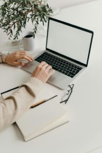 A person typing on a computer 