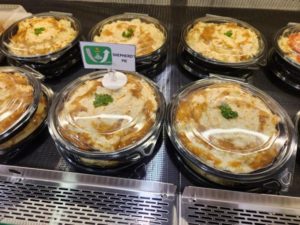 pies in plastic food packaging at a grocery store 