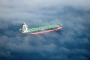 A ship in the clouds source: Photo by Marlin Clark from Pexels: https://www.pexels.com/photo/container-ship-on-sea-23221406/