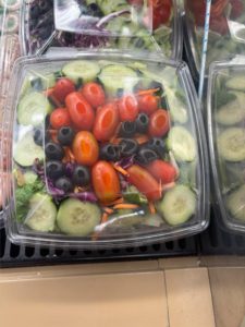 a salad in a plastic container 